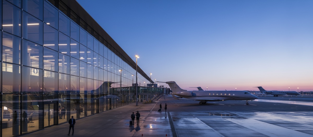Modern airport terminal at sunset.